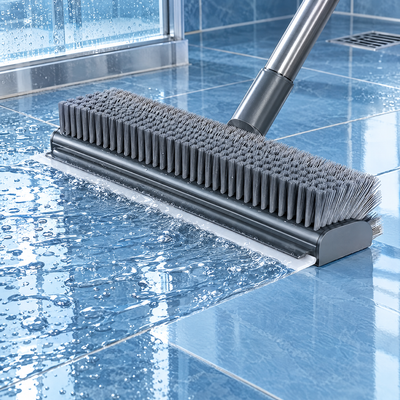 Squeegee removing water from shower floor